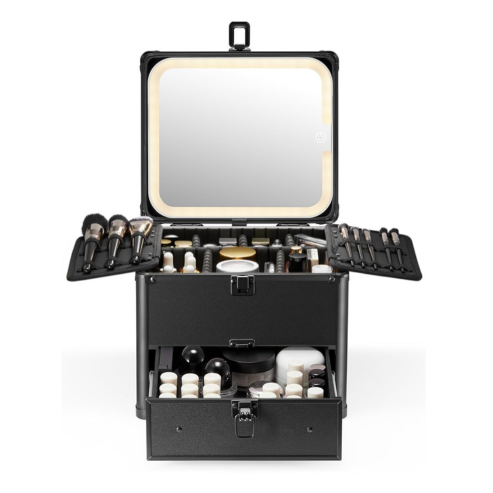 A black makeup box with drawer and a detachable lighted mirror, open and displaying various makeup items like brushes and bottles.