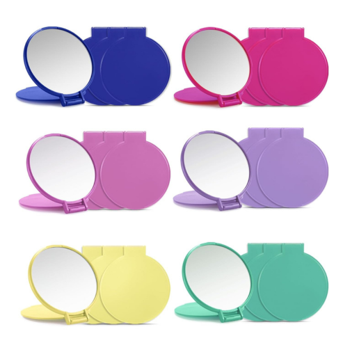 An array of compact, folding mirrors in various colors including blue, pink, purple, yellow, light blue, green, and red, displayed in rows.