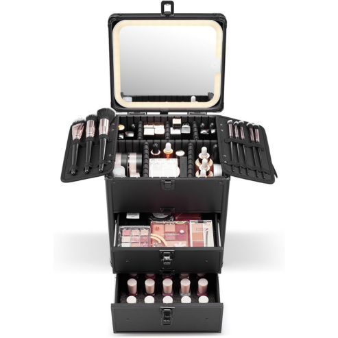 Black makeup case with open drawers filled with cosmetic products on a white background