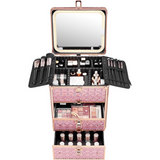 Pink makeup case with mirror and various cosmetic items on a white background