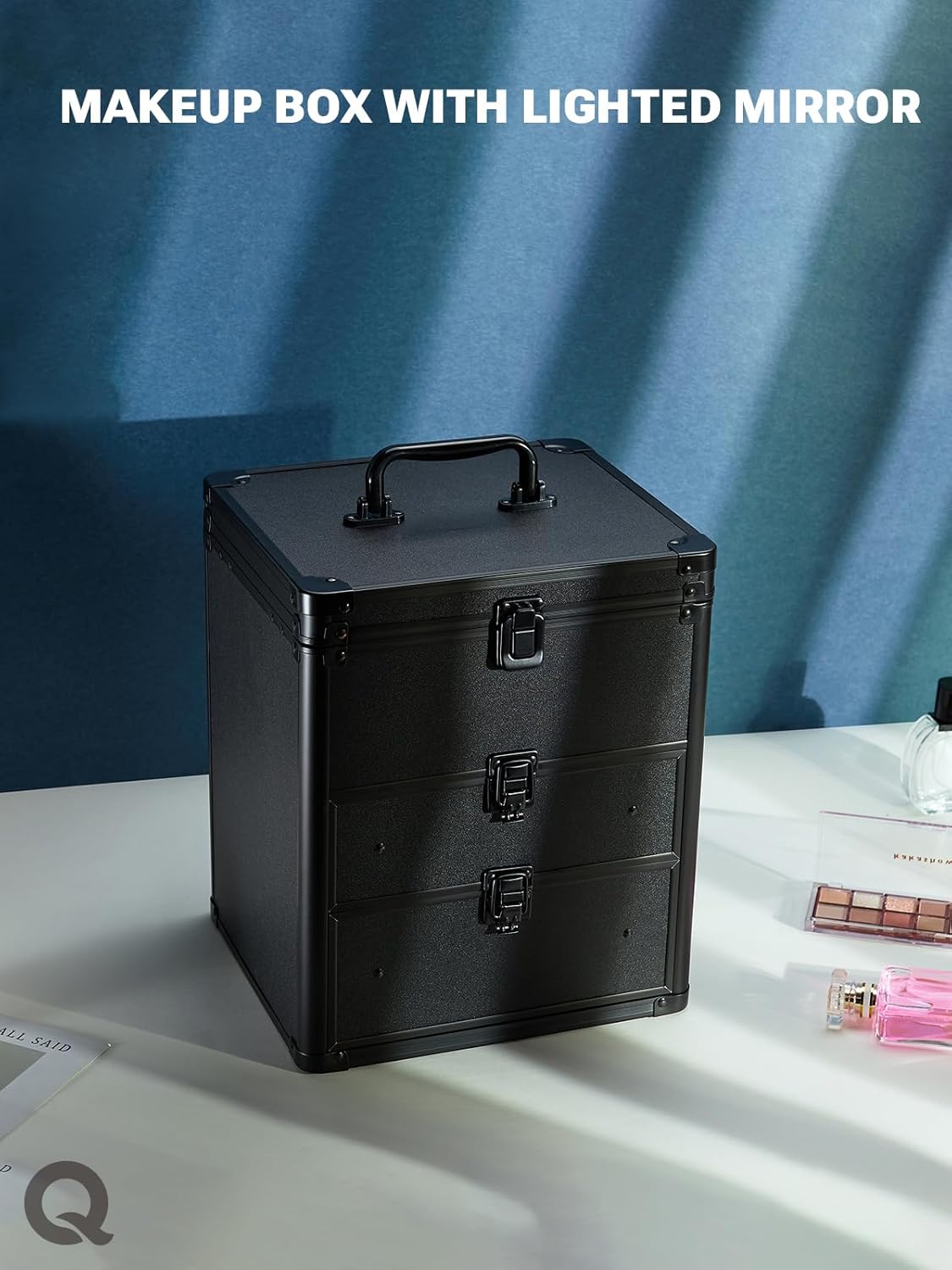 Black makeup box on a white surface with a blue background