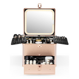 A rose gold makeup box with drawer and a detachable lighted mirror, open and displaying various makeup tools and compartments.