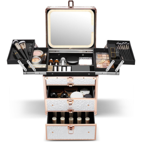 Makeup case with drawers and various tools and products on a white background