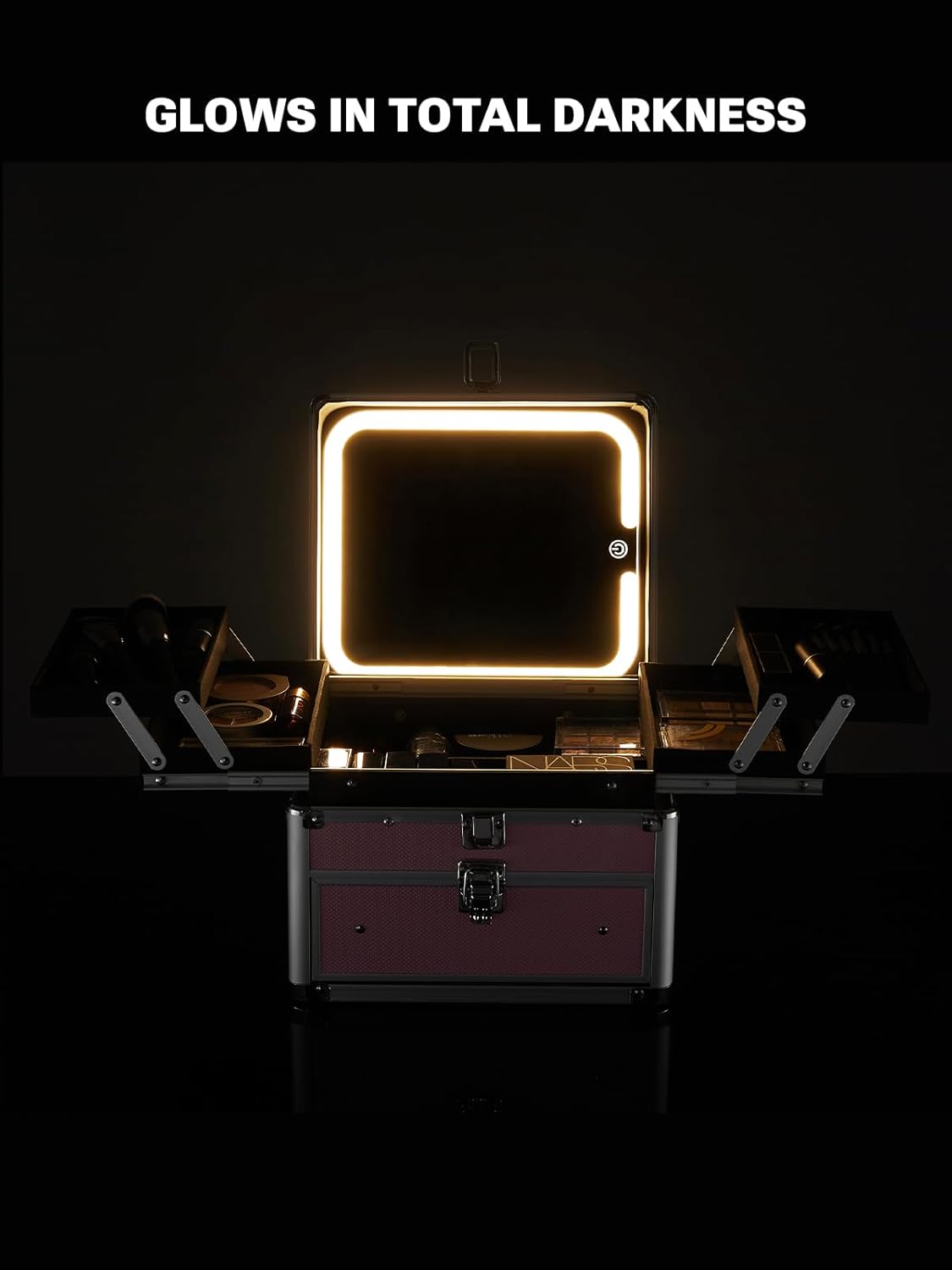 Makeup case with a light-up mirror on a dark background, highlighting its feature of glowing in total darkness.