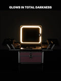 Makeup case with a light-up mirror on a dark background, highlighting its feature of glowing in total darkness.