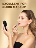 woman applying a lipstick while holding a black makeup round mirror