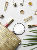 flatlay of beauty products on a white surface