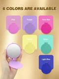 small round compact mirrors with different colors on a beige background