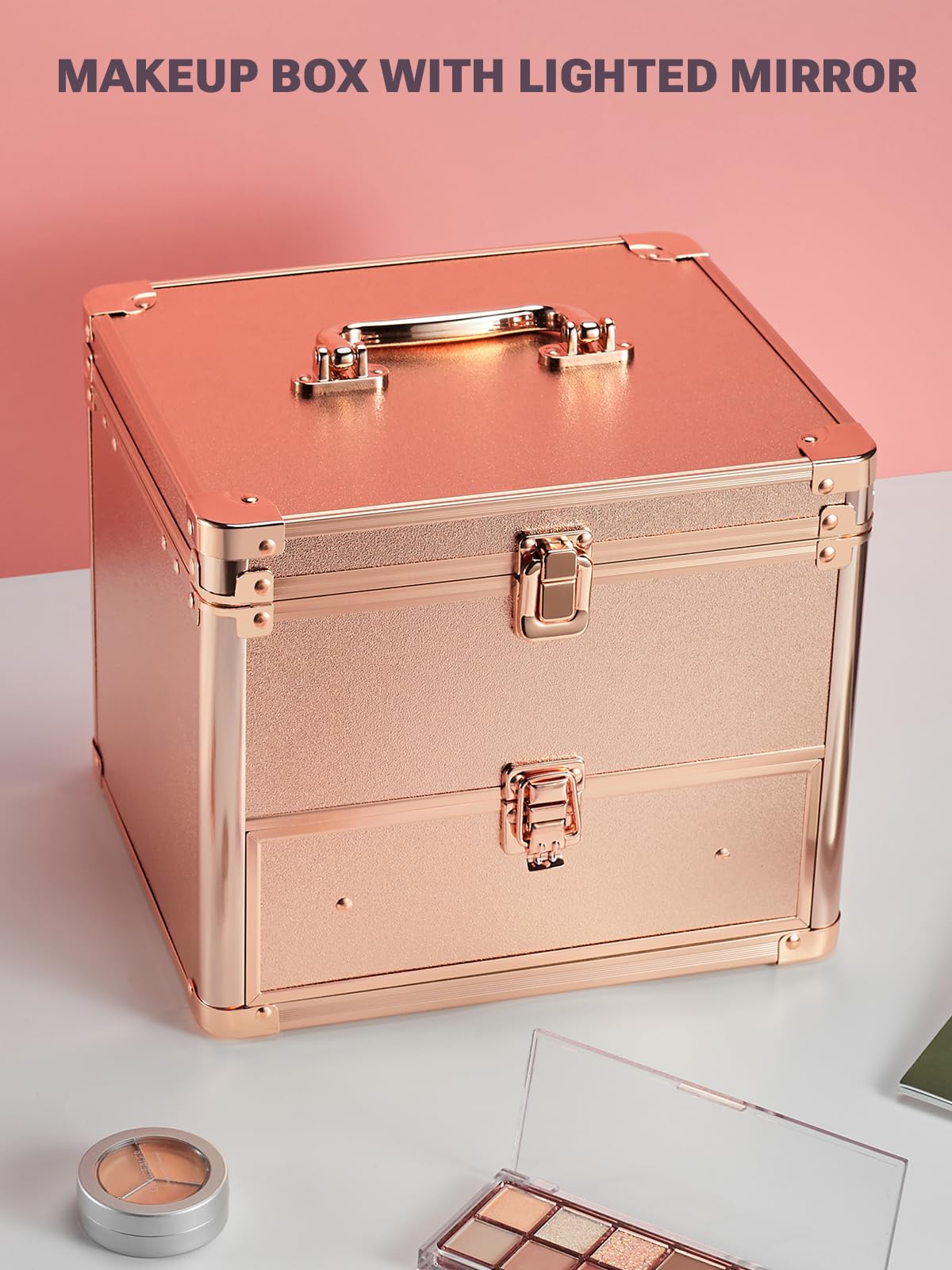 rose gold makeup case with drawer on a white surface and pink background