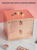 rose gold makeup case with drawer on a white surface and pink background