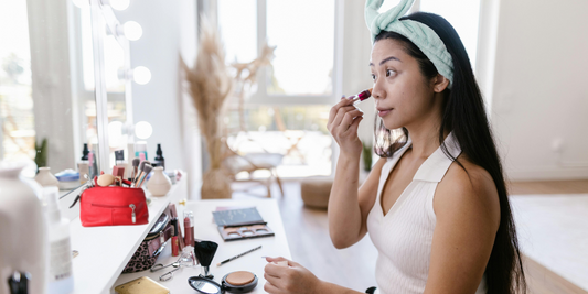 Qislee blog Woman applying makeup