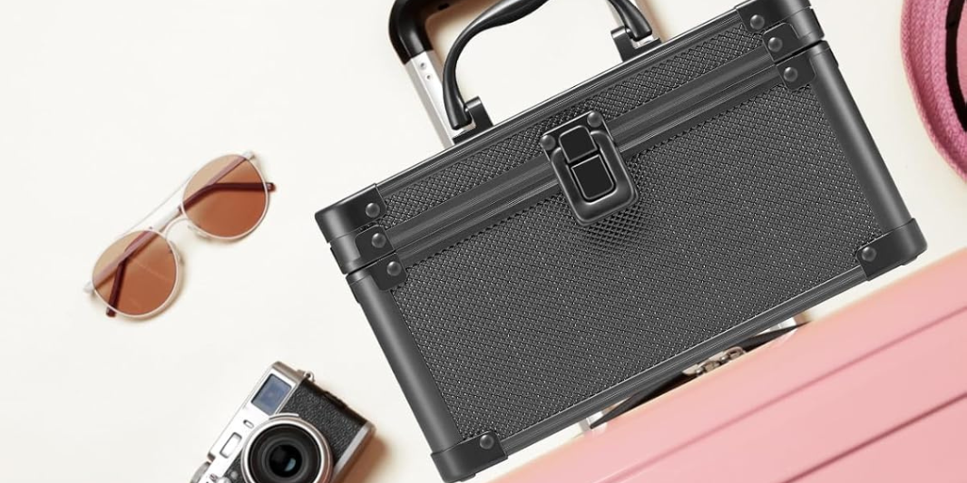 qislee black mini makeup case on a pink luggage